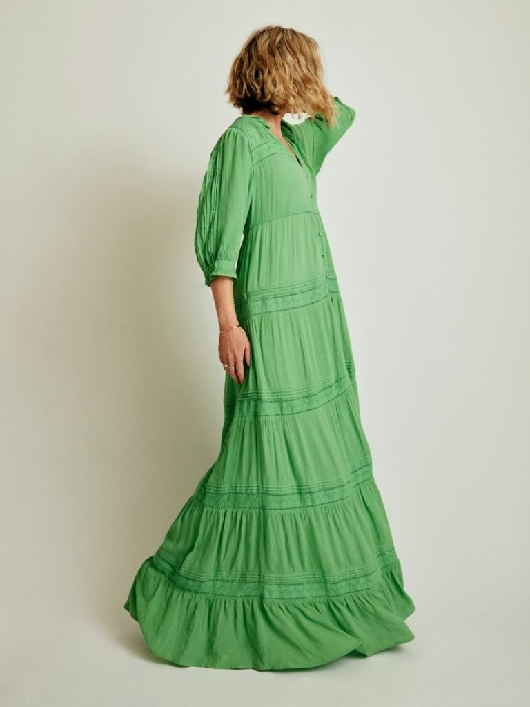 Model in a tiered saffron maxi dress